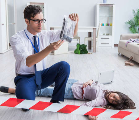 Forensic investigator at the crime scene investigating woman murの写真素材