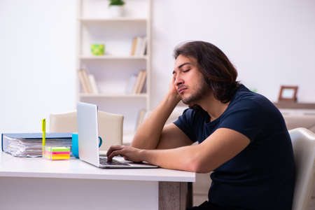 Young man employee working from houseの写真素材