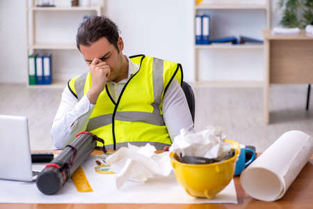 Young male architect working in the officeの写真素材