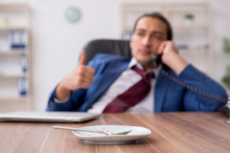 Young businessman working in the officeの写真素材