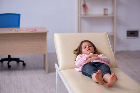 Small girl waiting for doctor in the clinicの写真素材