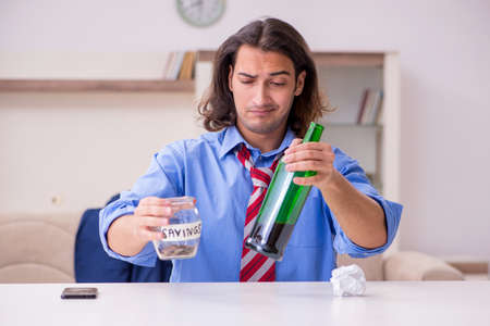 Young male employee being fired from his work at home