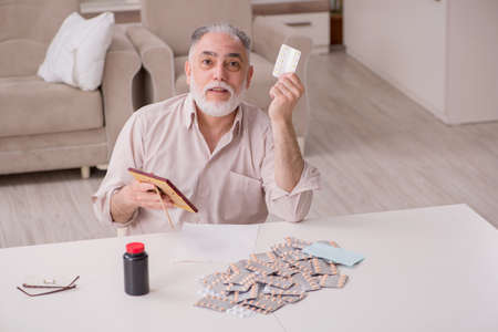 Old sick man suffering at home