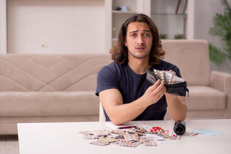 Young sick man suffering at home