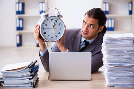 Workload male employee in time management conceptの写真素材