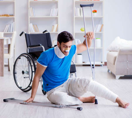 Injured young man recovering at homeの写真素材