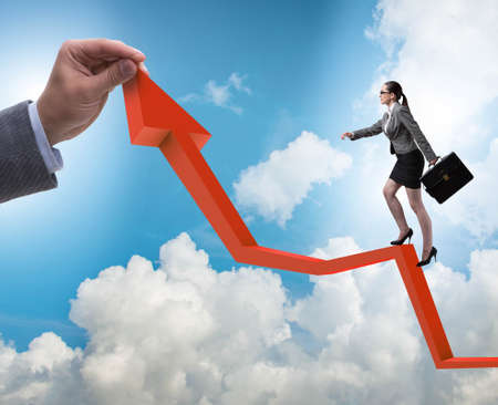 Businesswoman climbing line chart in economic recovery concept