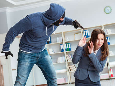 Criminal taking businesswoman as hostage in office