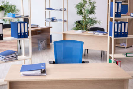 Young male bookkeeper working in the officeの写真素材