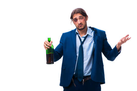 Young male employee alcoholic isolated on white