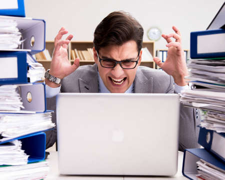 Busy businessman under stress due to excessive work