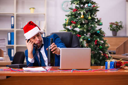 Employee in the office during christmas partyの写真素材