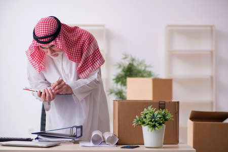 Old arab businessman in office relocation conceptの写真素材