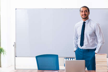 Young male employee in business presentation conceptの写真素材