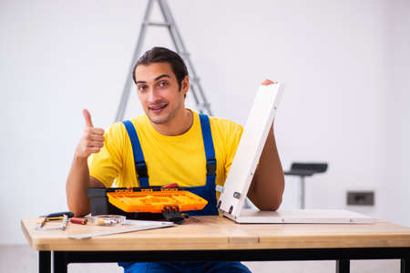 Young male carpenter working indoorsの写真素材