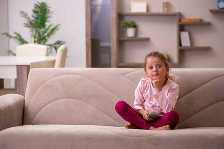 Small girl staying alone at homeの写真素材