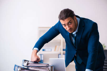 Young male businessman employee working in the officeの写真素材