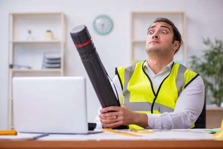 Young male architect working in the officeの写真素材
