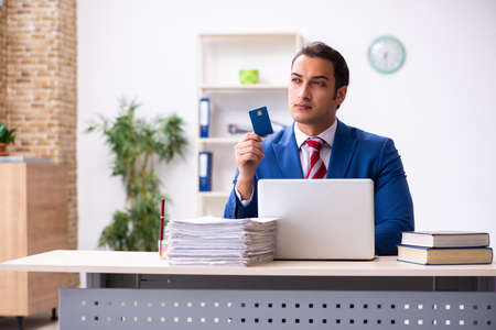 Young male employee working in the officeの写真素材