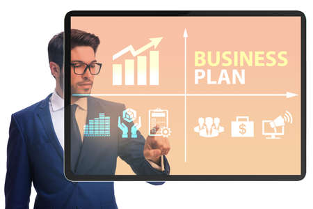 Business plan concept with businessman pressing buttonの写真素材