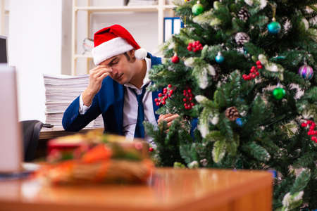 Employee in the office during christmas partyの写真素材