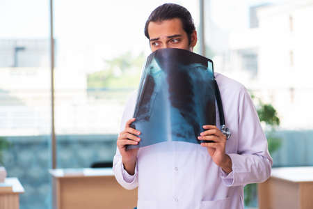 Young male doctor radiologist working in the clinicの写真素材