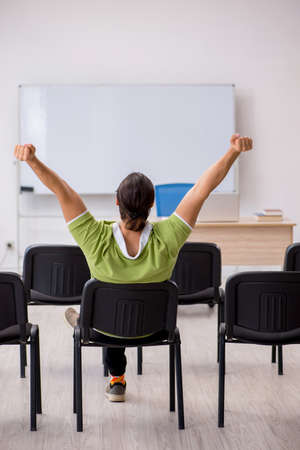 Young student in business presentation conceptの写真素材