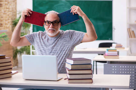 Old male student in tele-education conceptの写真素材