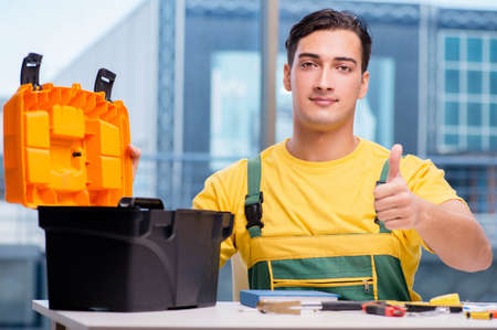 Construction worker sitting at the deskの写真素材