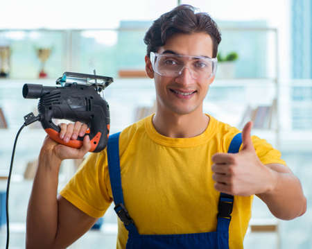 Furniture carpenter working in the workshopの写真素材