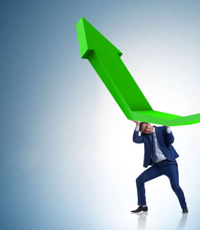 Businessman supporting growtn in economy on chart graphの写真素材