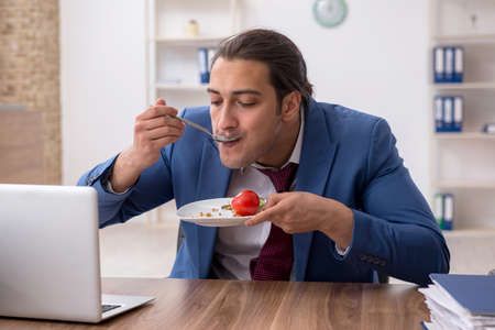 Young businessman working in the officeの写真素材