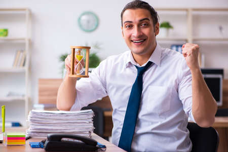 Young male employee working in the officeの写真素材
