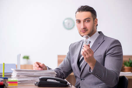 Young male employee working in the officeの写真素材