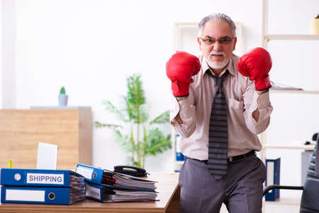 Businessman angry and furious at the workplaceの写真素材