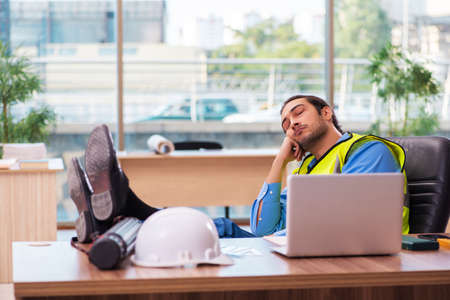 Young male architect working in the officeの写真素材