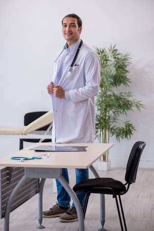 Young male doctor working in the clinicの写真素材