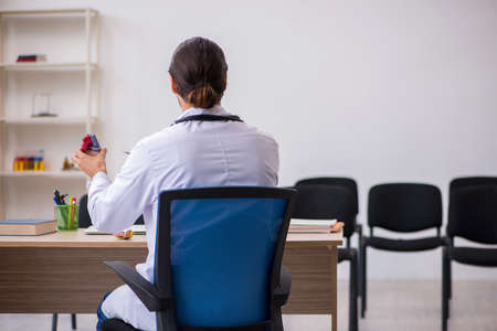 Young male doctor cardiologist giving seminar in the classroomの写真素材