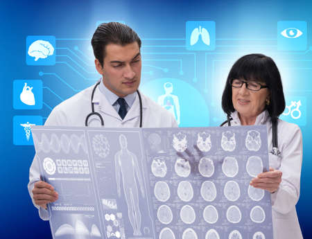 Two doctors discussing x-ray image in telemedicine concept