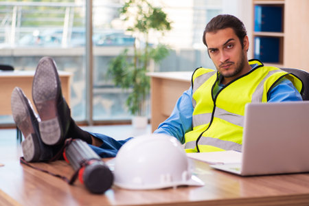Young male architect working in the officeの写真素材