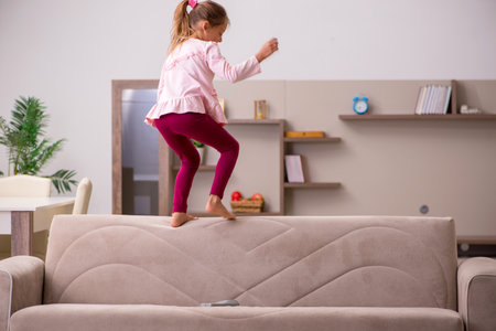 Small girl staying alone at homeの写真素材