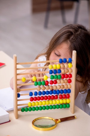 Small girl preparing for exams at homeの写真素材