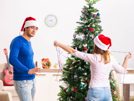 Young family celebrating christmas at homeの写真素材