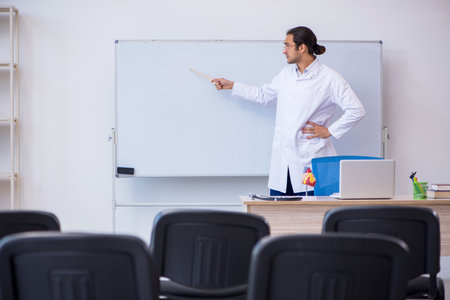 Young male doctor giving seminar in the classroomの写真素材