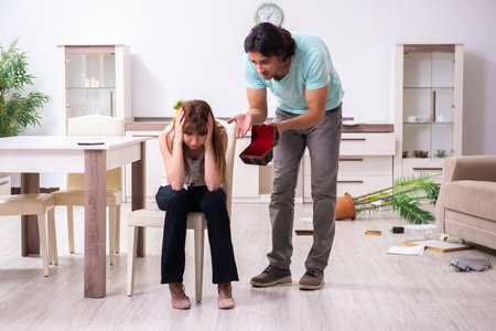 Young couple found their house after burglary robbed by burglarsの写真素材