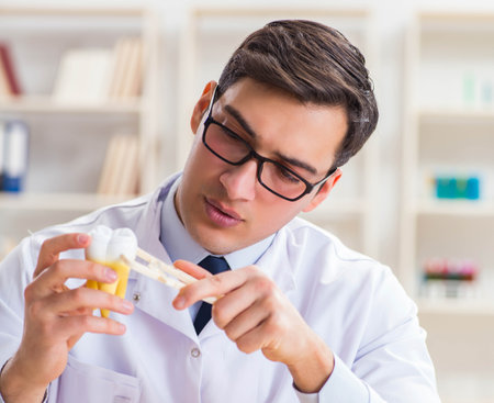 Young dentist working in the dentistry hospitalの写真素材