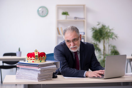 Old king businessman employee at workplaceの写真素材