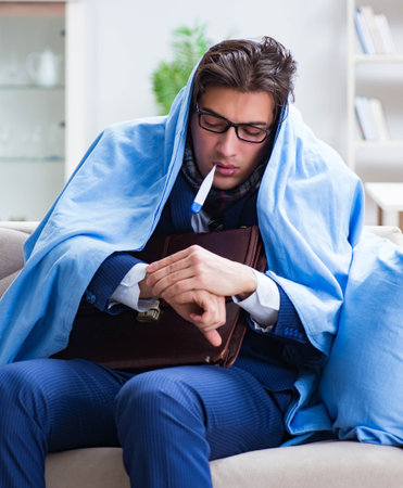 Sick employee staying at home suffering from flueの写真素材