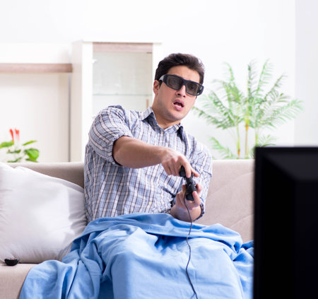 Man playing 3d games at homeの写真素材