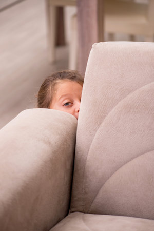 Small girl staying alone at homeの写真素材